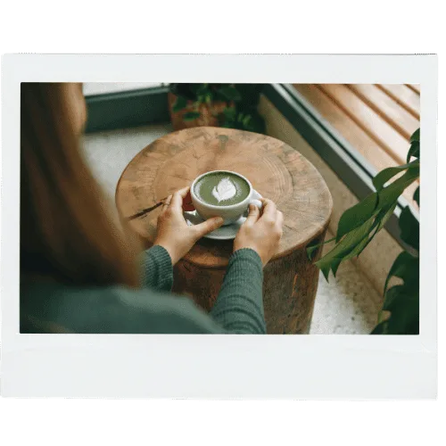 Best matcha for lattes — matcha powder and bamboo whisk prepared for a milk-based latte