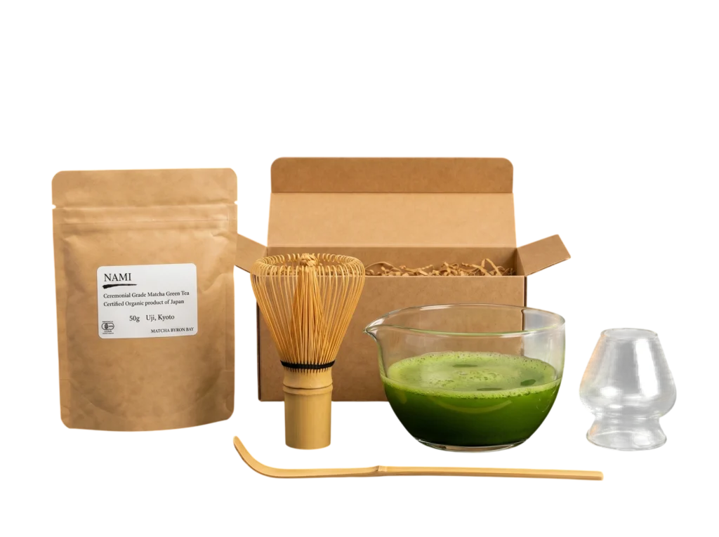 Nami organic Japanese matcha ritual set with matcha powder, glass bowl, bamboo whisk, bamboo scoop, and glass whisk holder.