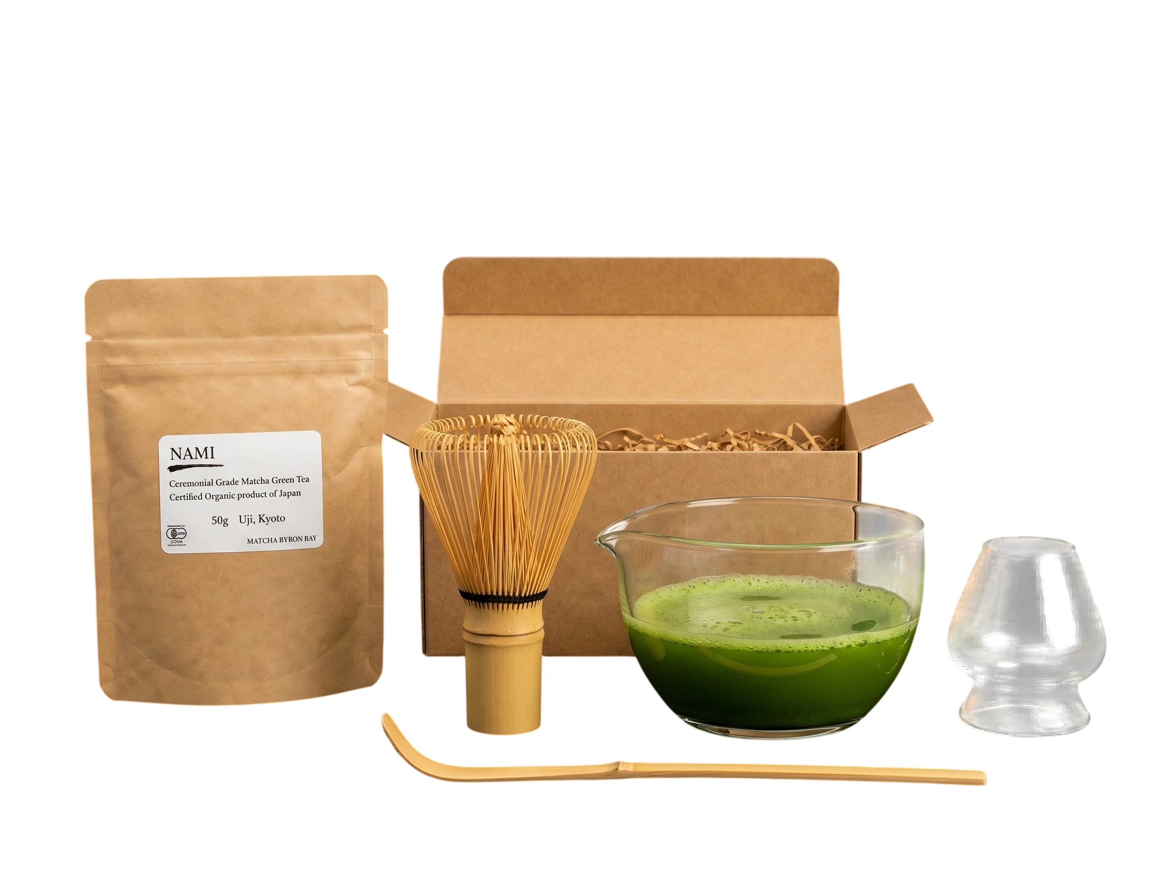 Nami organic Japanese matcha ritual set with matcha powder, glass bowl, bamboo whisk, bamboo scoop, and glass whisk holder.